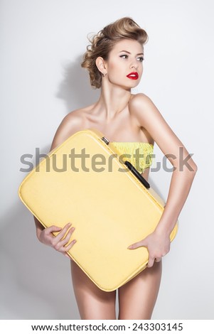 beautiful woman with vintage suitcase