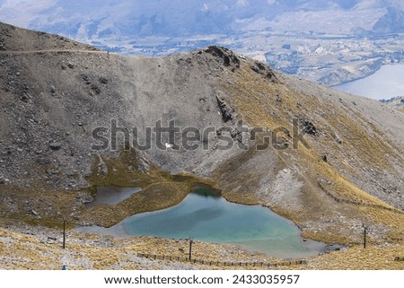 Glacier Mountain Lake on top of the Remarkable Mountain Range in New Zealand
