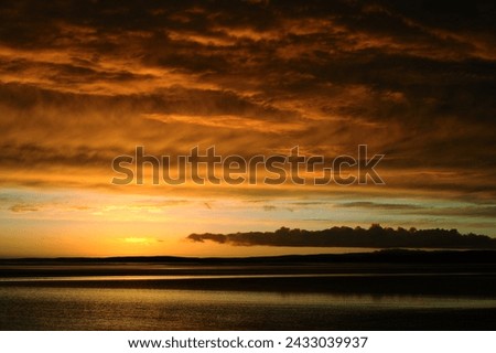 Dramatic sunset sky on Morecambe Bay, UK. One of the largest intertidal regions of Europe. No filters or image editing used.