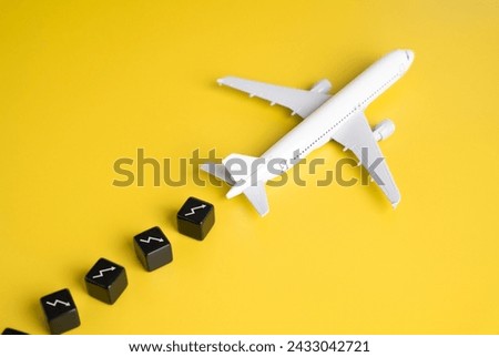The passenger plane leaves losses. Crisis and falling profitability in the airline industry. Rising fuel costs, intense competition, and unforeseen circumstances like global pandemics. Sustainability Royalty-Free Stock Photo #2433042721
