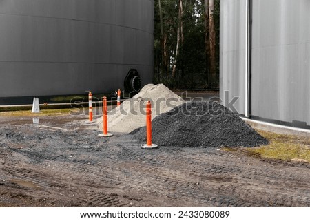 Hazard cones placed near a road undergoing infrastructure work.