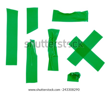 Multiple pieces of green insulating tape of different shapes, isolated over the white background