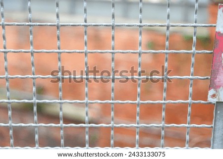 metal grid for protection as a barrier of a confinement field Royalty-Free Stock Photo #2433133075