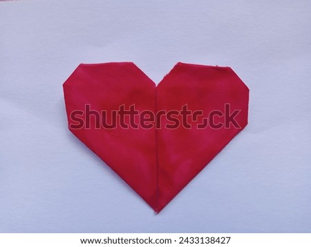 A Red Heart Made out of Paper Origami Looks Cute