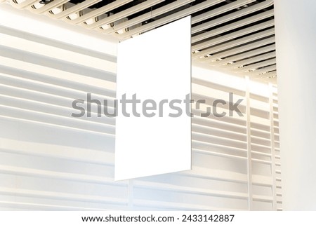 Blank advertising billboard hanging in the supermarket. Blank White Supermarket Banners Hanging From Ceiling. Hangers Mockup Ready For Branding Or Advertising, clipping path.