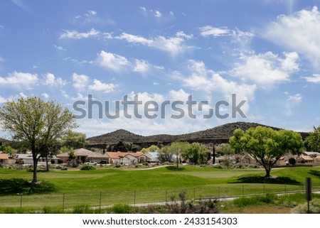 Nature in Arizona on a summer sunny day. Landscape with mountains in desert and blue sky with fluffy clouds. Restarea in Arizona 