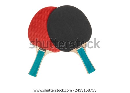 Red and black table tennis rackets highlighted on a white background with a cropping outline. Sports equipment for ping pong in a minimalist style. Flat surface, top view. Royalty-Free Stock Photo #2433158753