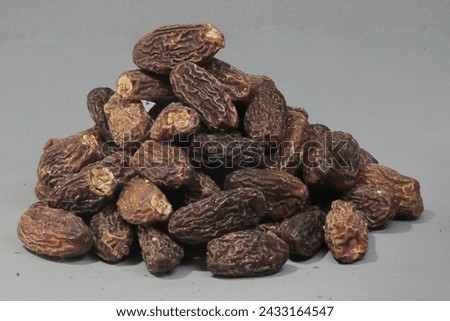 Brown Organic dry Dates are completely dehydrated and sun-dried. Unlike semi-dry dates, Dry dates are quite hard in texture. Dry dates have lesser moisture and hence stay fresh for a longer period of  Royalty-Free Stock Photo #2433164547