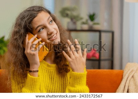 Phone call, good news, gossip. Portrait of happy 14-15 years child girl in pleasant conversation on smartphone, enjoying talking with friend. Teenager Caucasian female kid at home room apartment Royalty-Free Stock Photo #2433172567