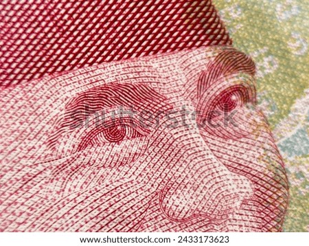 Extreme macro photography of 100 thousand rupiah banknotes. Very close to the One Hundred Thousand Rupiah banknote. Rupiah is the currency of Indonesia.