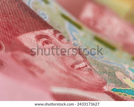 Extreme macro photography of 100 thousand rupiah banknotes. Very close to the One Hundred Thousand Rupiah banknote. Rupiah is the currency of Indonesia.