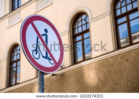 Scooter ban. Sign prohibiting movement on a scooter on a city street Royalty-Free Stock Photo #2433174351