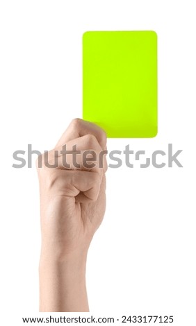 Referee holding yellow card on white background, closeup