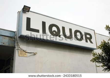 Liquor Sign. Liquor Store. Neon Sign. Building Sign. Food and Drink. booze. alcohol. Liquor. For sale. 

