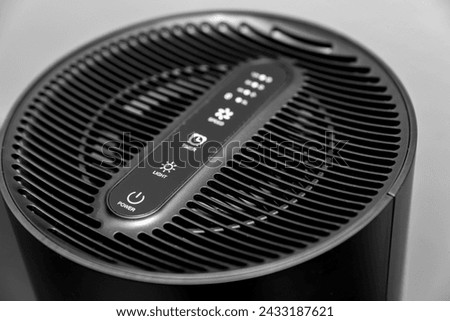 Air purifier health technology in cozy modern living room and cleaning removing dust PM2.5, Air purifier for fresh air and healthy life, Health care Air Pollution Concept. clean dust and fresh home Royalty-Free Stock Photo #2433187621