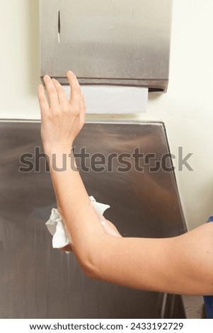 Surgeon having his hands surgically washed. A Caucasian doctor dressed in his right-hand profile with his hands full of foam and dressed in his surgical uniform.	 Royalty-Free Stock Photo #2433192729