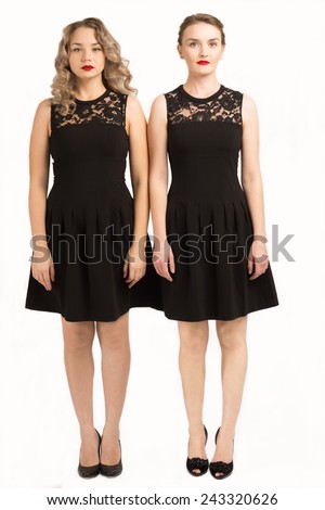 two beautiful girls in the same black dress