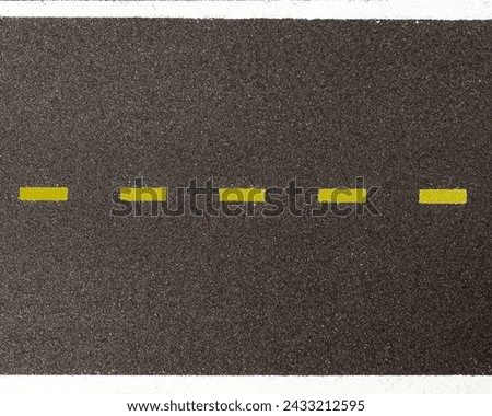 Aerial view of asphalt with a yellow dashed dividing line and white continuous lines delimiting the road Royalty-Free Stock Photo #2433212595