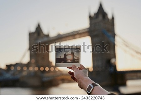 Tourist, photograph and London bridge, traveling and tourism, holiday sightseeing memory or building icon, adventure or vacation. Photography, picture print or tower in England city skyline at sunset