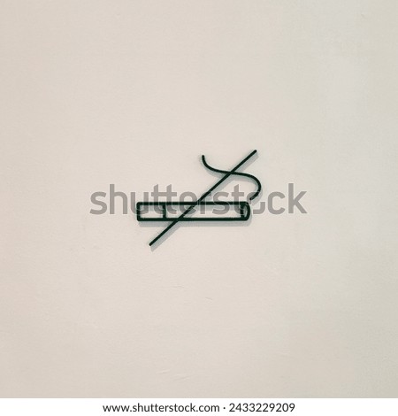 No smoking sign on white Wall. Isolated on white background. Smoking is prohibited in public places.