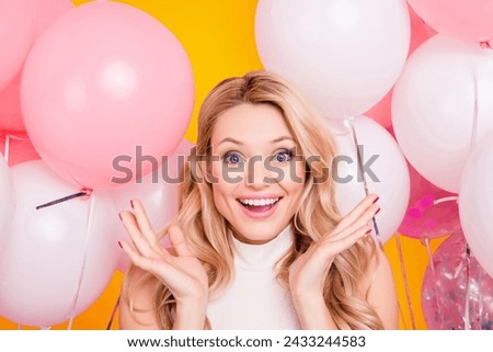 Portrait of impressed astonished girlfriend with unexpected unbelievable emotions gesturing with palms looking at camera isolated on pink background with many white air balloons Royalty-Free Stock Photo #2433244583