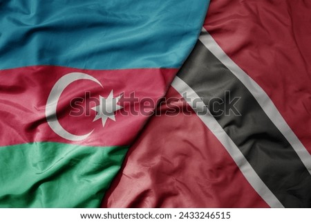 big waving national colorful flag of trinidad and tobago and national flag of azerbaijan. macro