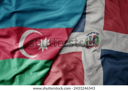 big waving national colorful flag of dominican republic and national flag of azerbaijan. macro