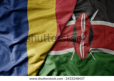 big waving national colorful flag of kenya and national flag of romania . macro