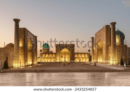 Evening view of the Registan Square in Samarkand, Uzbekistan. The Ulugh Beg Madrasah, the Tilya-Kori Madrasah and the Sher-Dor Madrasah. The Registan is a popular tourist attraction of Central Asia. Royalty-Free Stock Photo #2433254857