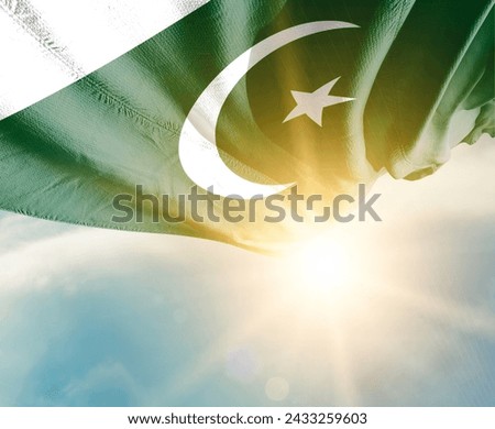 Pakistan waving flag in beautiful sunlight. Royalty-Free Stock Photo #2433259603