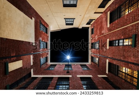 sky view from below between buildings concept and space for your text Royalty-Free Stock Photo #2433259813