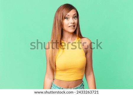pretty adult woman looking puzzled and confused
