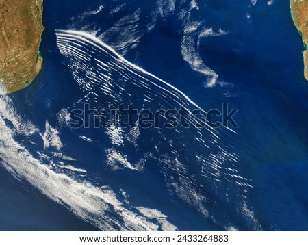 Atmospheric gravity waves over the Mozambique Channel. Atmospheric gravity waves over the Mozambique Channel. Elements of this image furnished by NASA. Royalty-Free Stock Photo #2433264883