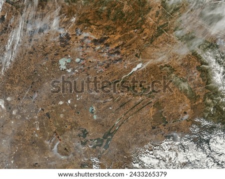 Fires in central Russia. Fires in central Russia. Elements of this image furnished by NASA. Royalty-Free Stock Photo #2433265379