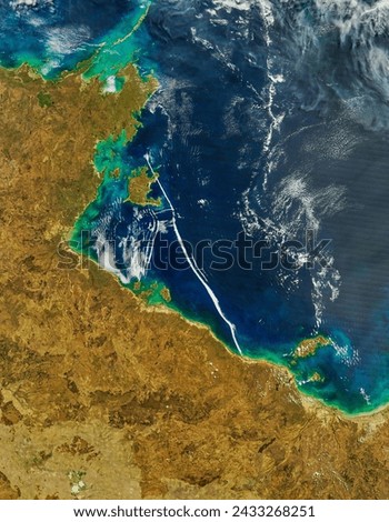 Atmospheric gravity waves over the Gulf of Carpentaria. Atmospheric gravity waves over the Gulf of Carpentaria. Elements of this image furnished by NASA. Royalty-Free Stock Photo #2433268251