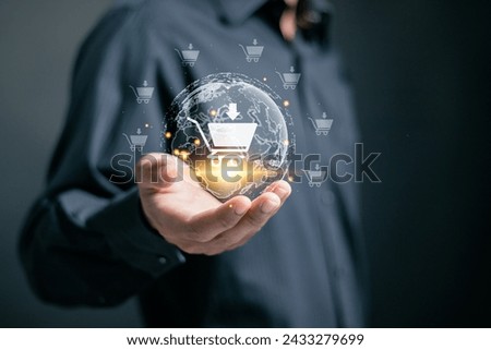 Businessman holding virtual globe with e-commerce icons of shopping for online shopping. Add to cart, internet store, buy online and e-commerce concept. Royalty-Free Stock Photo #2433279699