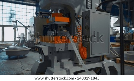 Machines with hole punch for metal line. Creative. Long metal line on industrial machines. Workshop with automated machines at metallurgical plant Royalty-Free Stock Photo #2433291845