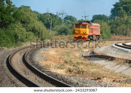 Old Train yellow and Orange Diesel Electric locomotives on the tracks moves Thailand  Royalty-Free Stock Photo #2433293087