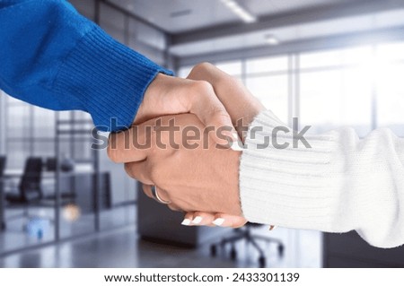 young happy couple shaking hands