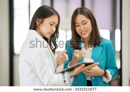 Asian business woman working and talking at the office
