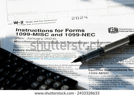1099 Misc. and W2 Internal Revenue Service tax forms. Royalty-Free Stock Photo #2433328633