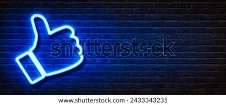 Neon sign on a brick wall - Thumb up