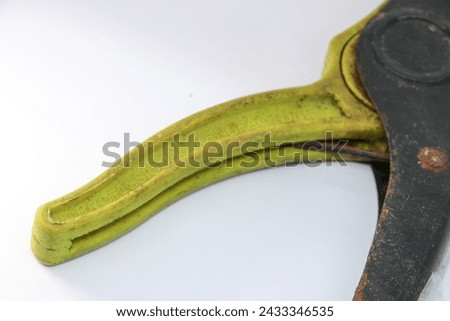 A green rusty used Automatic cable peeler for special applications

 on isolated white background. 