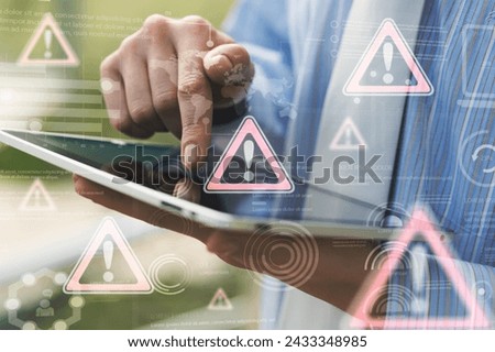 Business person using tablet computer with hologram