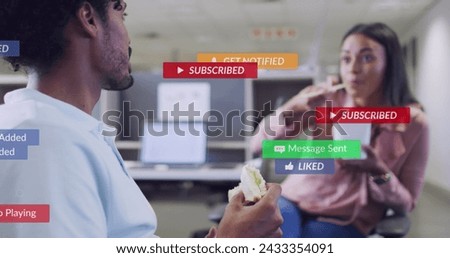 Image of media icons over diverse business people eating in office. Global business and digital interface concept digitally generated image.