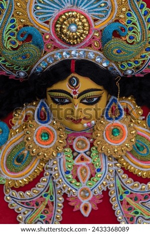Decorated idol of Hindu Goddess Durga with use of selective focus . Close up.