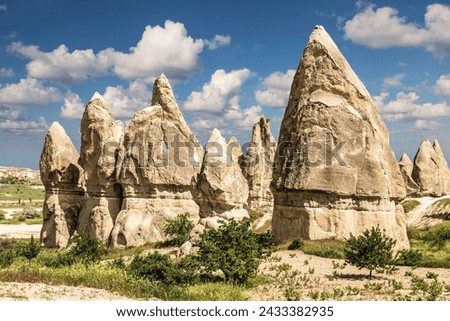 Unique geological formations in Love Valley in Cappadocia, popular travel destination in Turkey Royalty-Free Stock Photo #2433382935