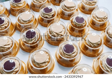 Delicious cupcakes in package, closeup