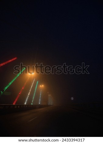 A night Picture of the the giant bridge (Constantine) under fog with colorful lights