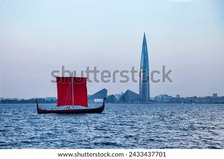Photo of classic sailboat with red sails contrasts against sleek skyscraper skyline over calm waters. Traditional sailboat on modern urban skyline backdrop. Travel cruise concept. Copy ad text space